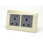 Gold Plastic Double Frame with dark grey insert of double switched neon uk socket