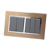 Gold Satin Metal Double Frame with dark grey insert of 5 gang light switches